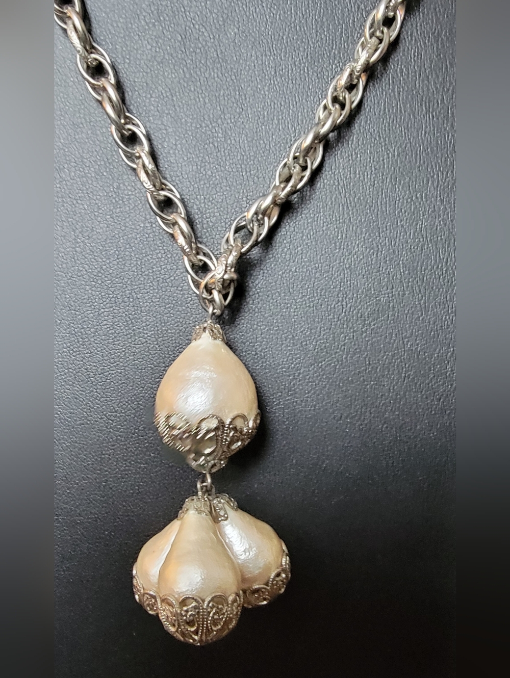 Vintage-style necklace features a large, pear-shaped faux pearl